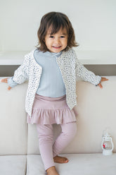 Baby girl wearing Avauma Aileen Bloom Cardigan in Lunabel Navy – soft and cozy floral cardigan for toddlers, featuring navy blue trim.